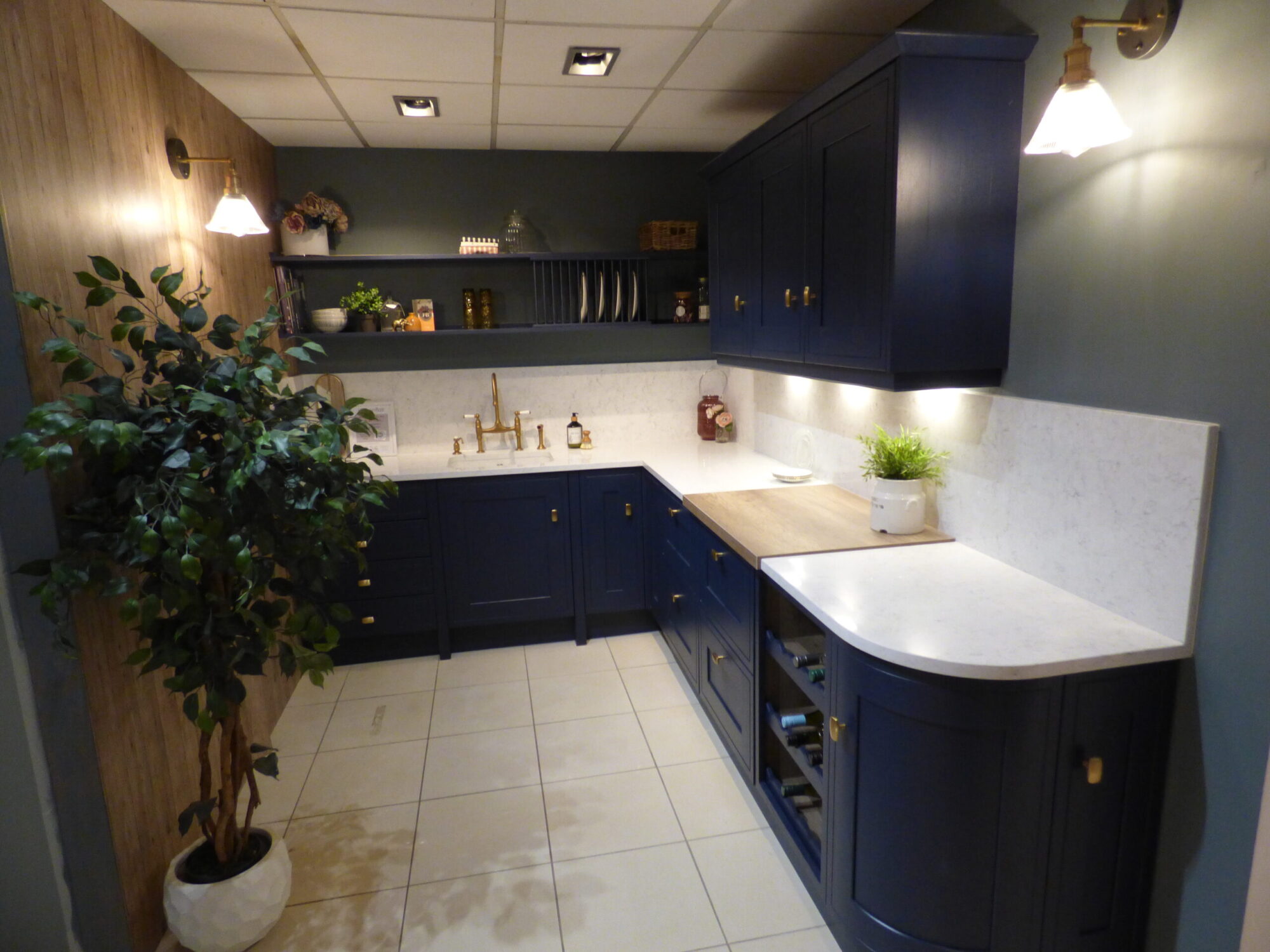 Small Kitchen with white worktops and blue cupboards