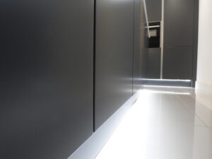 Close up of the Graphite doors. The light from the plinth makes the doors look like they float.