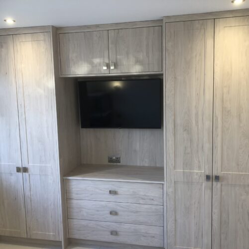 Jim Wright - Alnwick in Light Hickory Bedroom Fitteed Robes TV unit